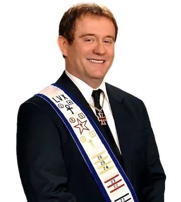 David Griffin, Imperator of the
          Order, wearing the LVX sash of the Second Order